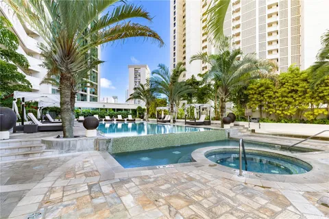 a view of a swimming pool with a patio
