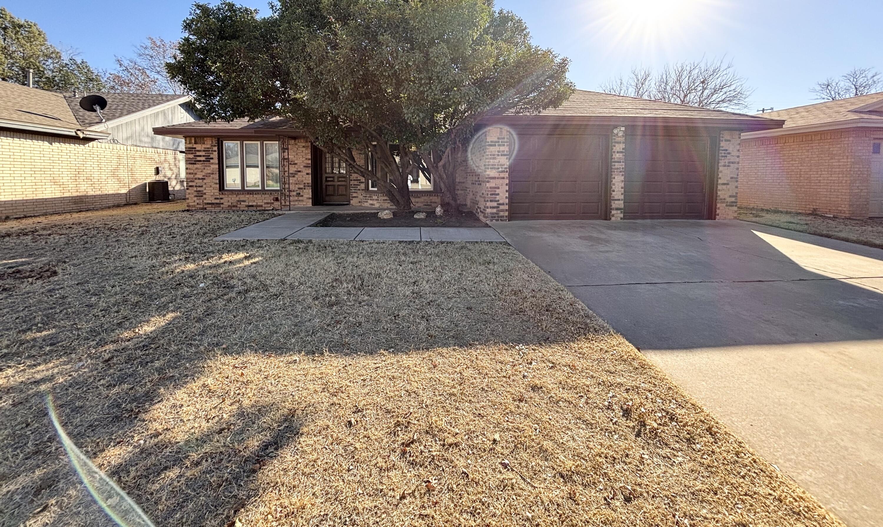 4913 62nd Street Lubbock, TX 79414 - Photo 1 of 22 a view of a house with a yard