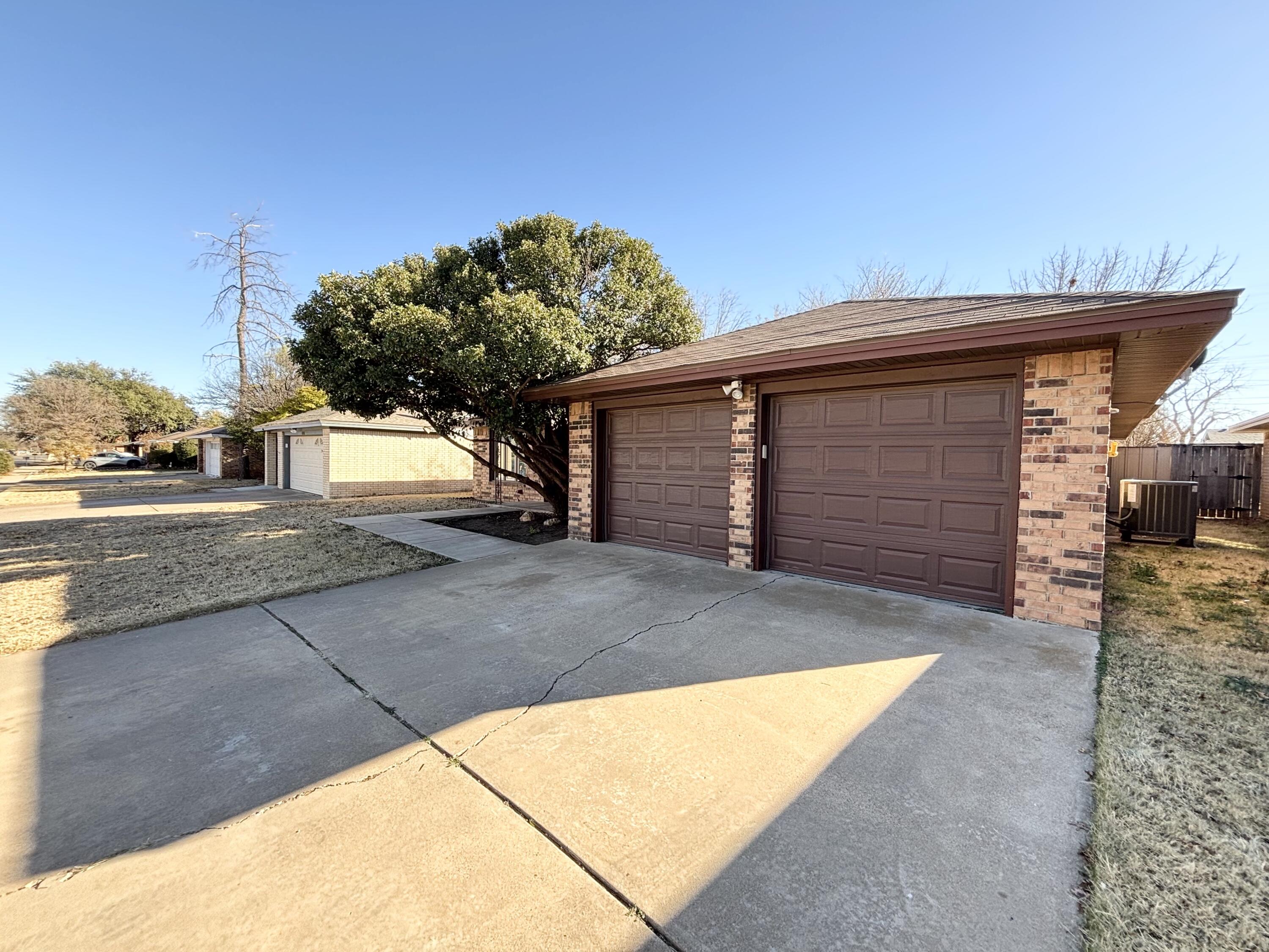 4913 62nd Street Lubbock, TX 79414 - Photo 2 of 22 a view of backyard of house