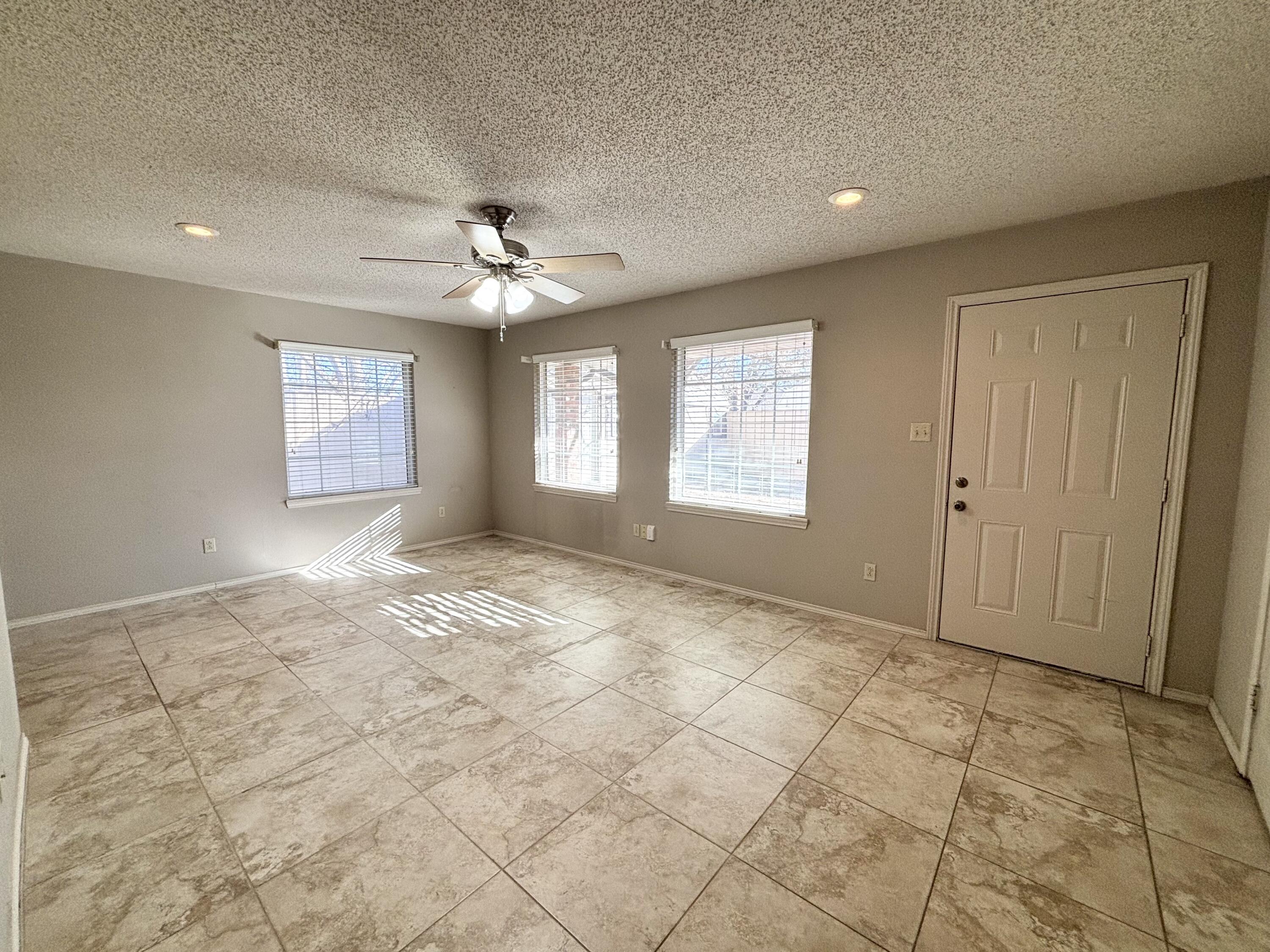 4913 62nd Street Lubbock, TX 79414 - Photo 9 of 22 a view of an empty room with a window