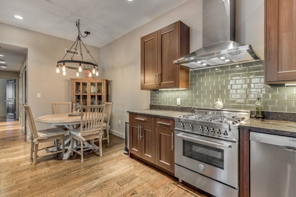 45 Vinton Street, Unit 5 Boston, MA 02127 - Photo 3 of 14 a kitchen with a stove and chairs