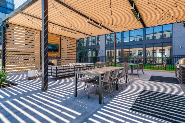 a view of swimming pool with outdoor seating
