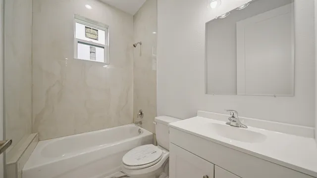 a bathroom with a sink toilet and bathtub