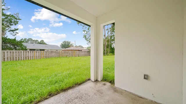 a view of a back yard from a room