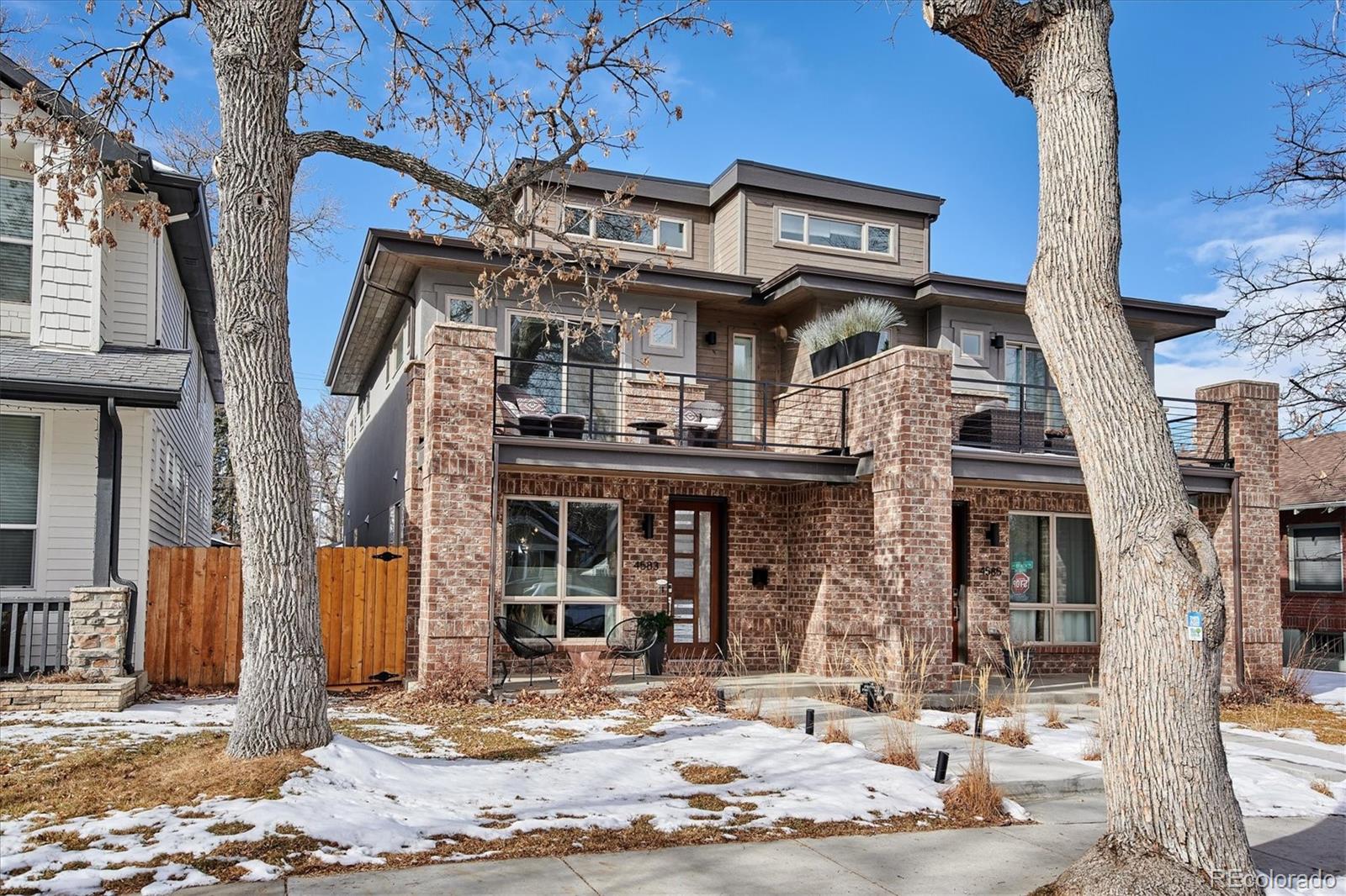 4583 Utica Street Denver, CO 80212 - Photo 1 of 40 a view of a building with a tree