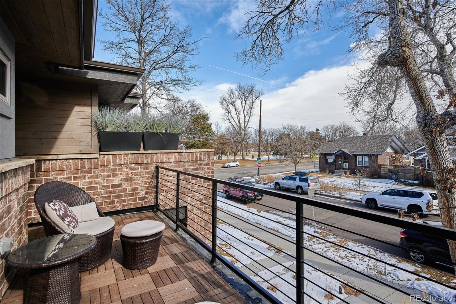 4583 Utica Street Denver, CO 80212 - Photo 20 of 40 a view of a chairs and table in the balcony