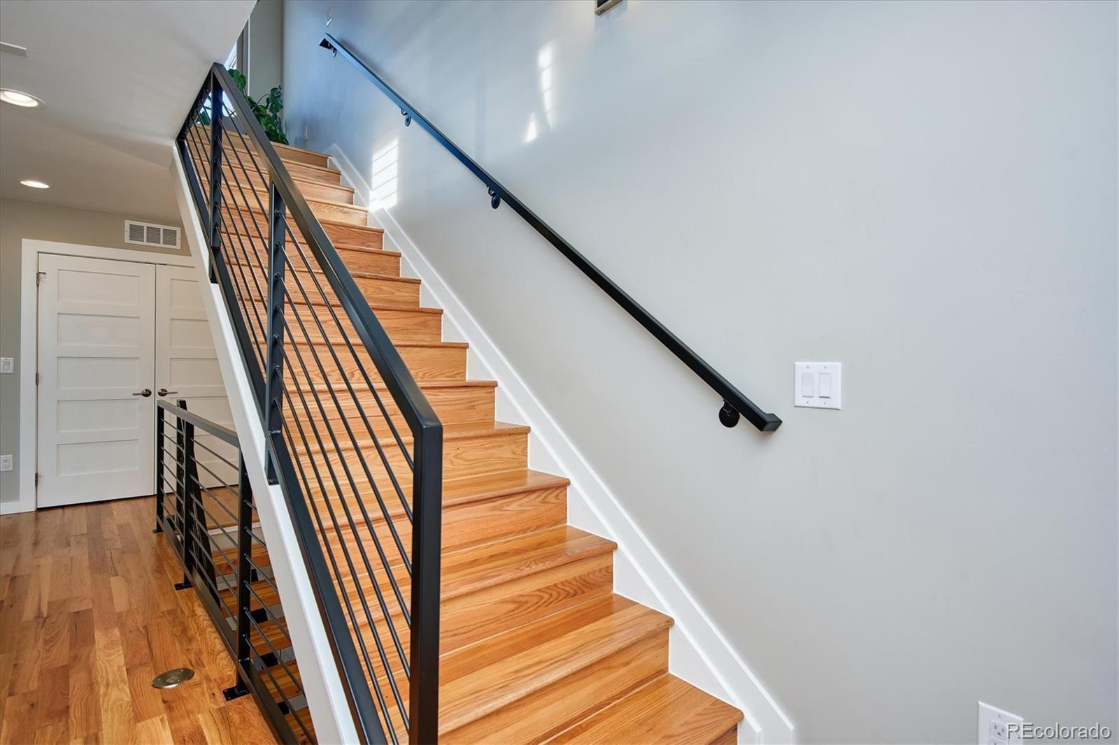 4583 Utica Street Denver, CO 80212 - Photo 24 of 40 a view of entryway and hall with wooden floor