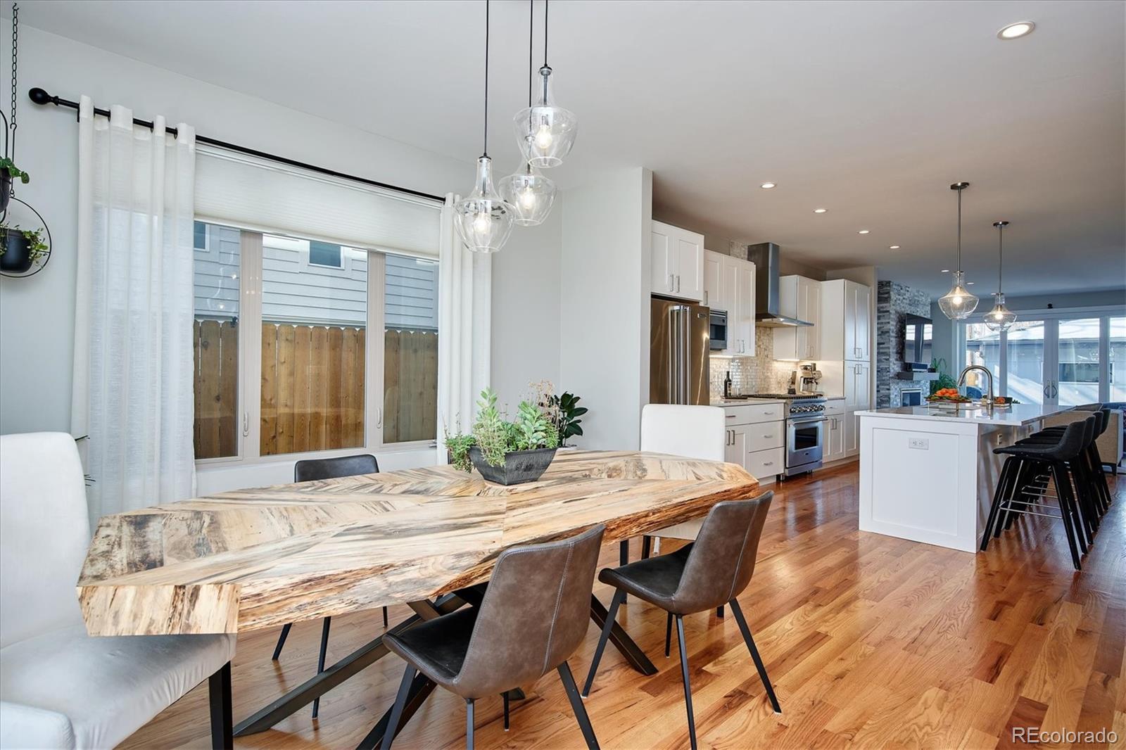 4583 Utica Street Denver, CO 80212 - Photo 4 of 40 a dining room with furniture and window