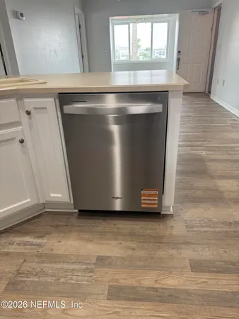 a view of kitchen with granite countertop a fireplace