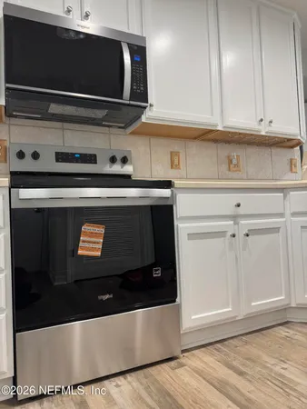 a view of a refrigerator in kitchen