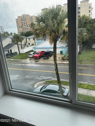 a view of swimming pool from a window