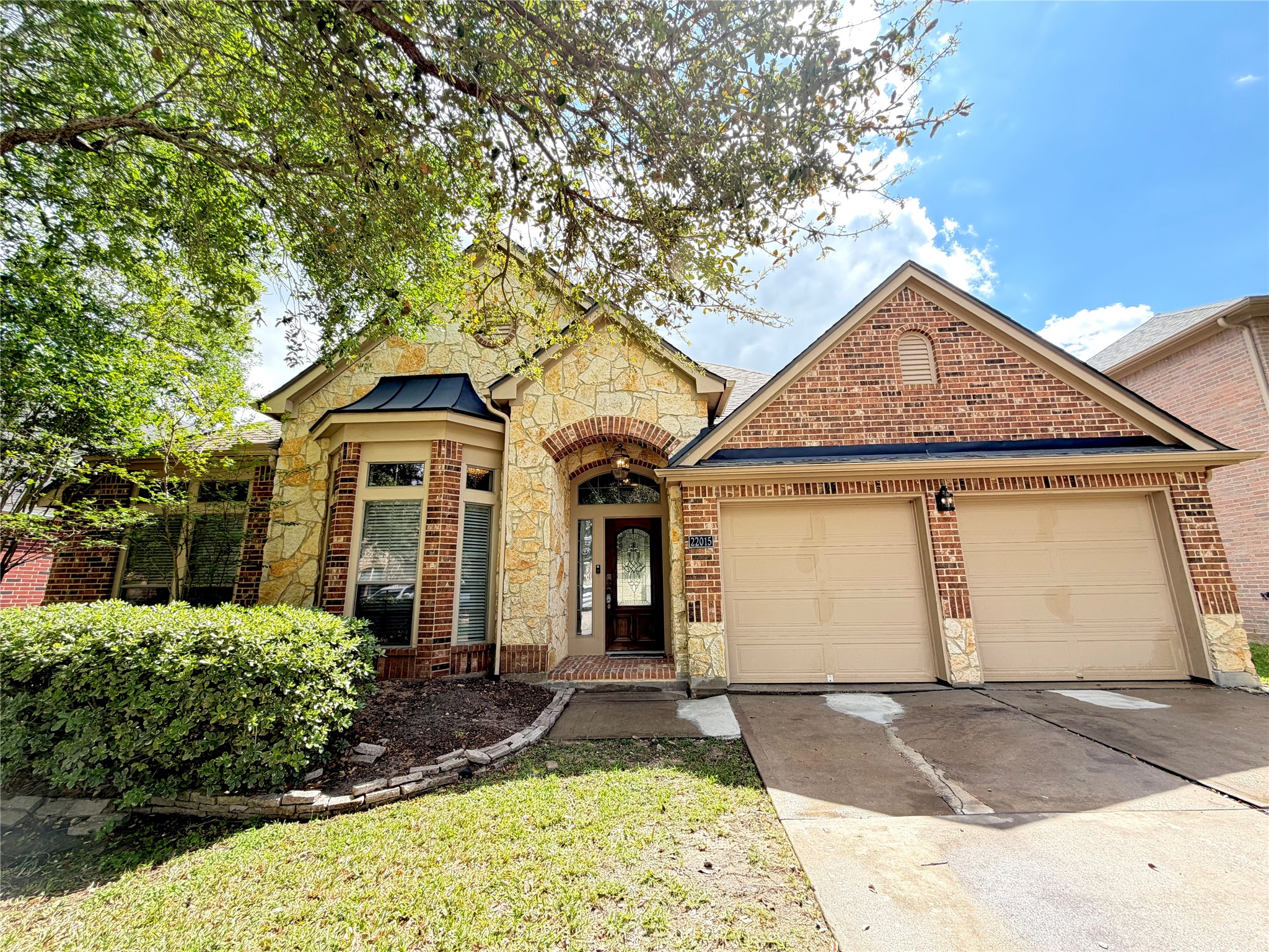 a front view of a house with garden