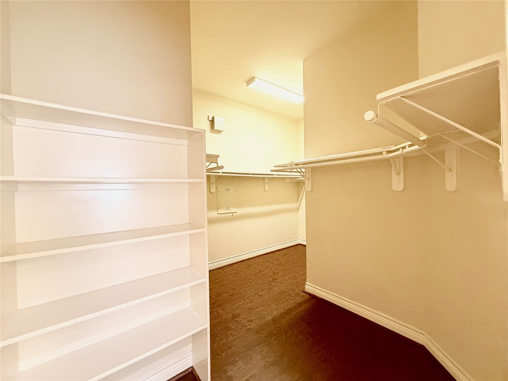 22015 Rustic Canyon Lane Richmond, TX 77469 - Photo 17 of 26 a view of walk in closet with empty racks