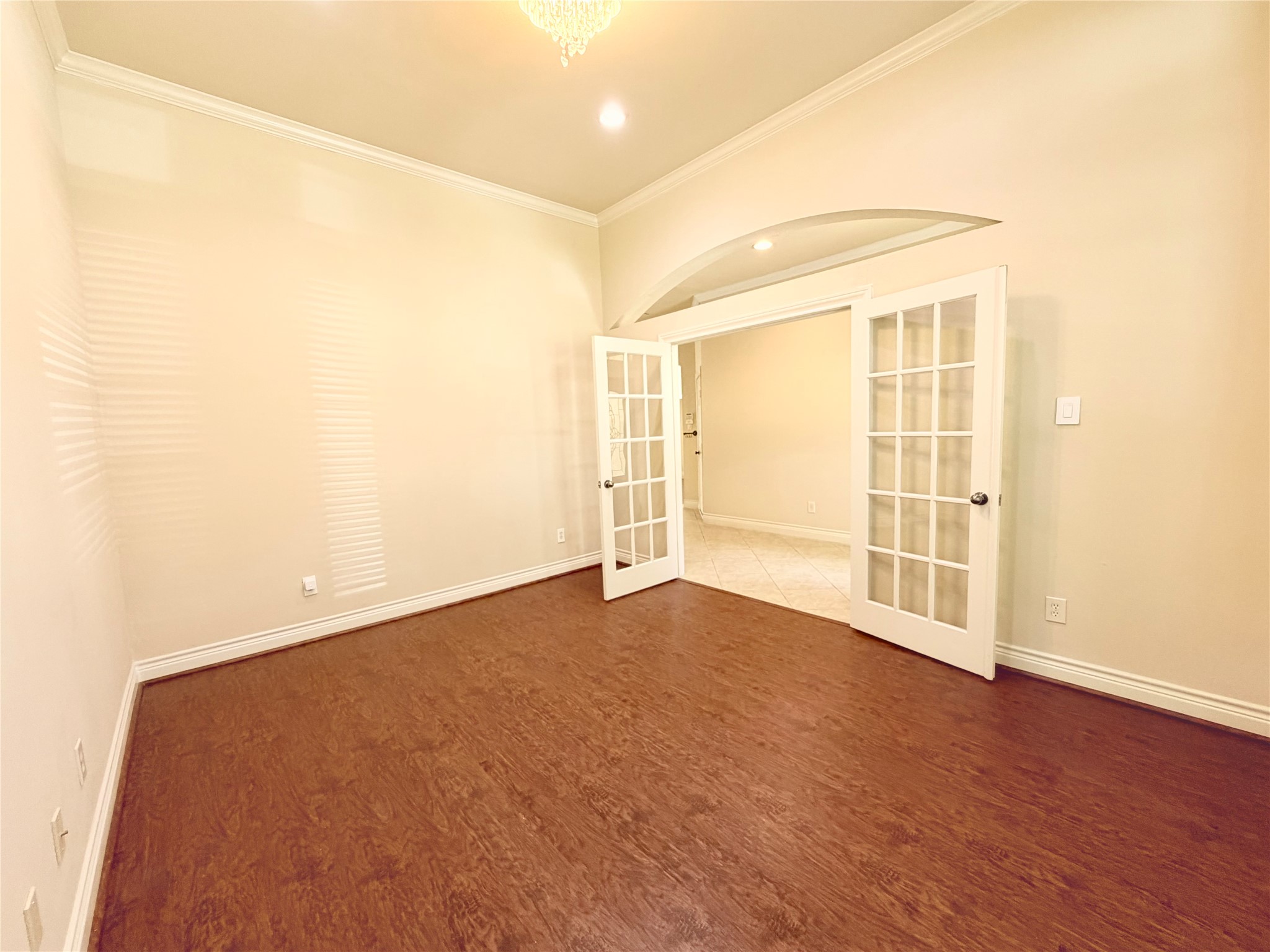 22015 Rustic Canyon Lane Richmond, TX 77469 - Photo 5 of 26 an empty room with wooden floor and windows
