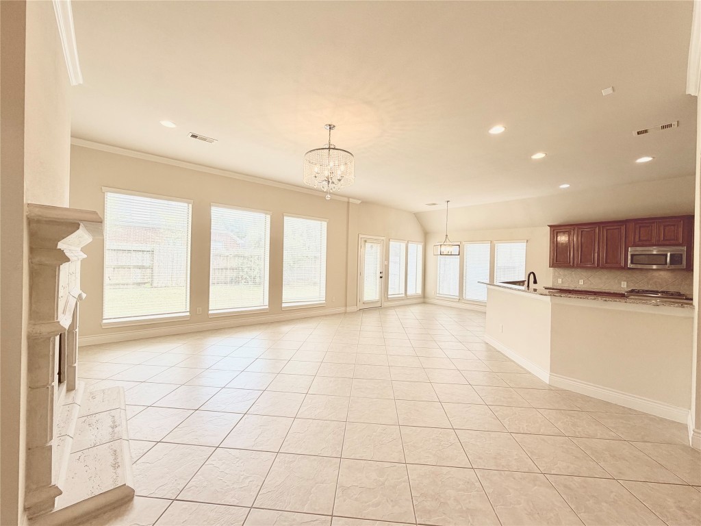 22015 Rustic Canyon Lane Richmond, TX 77469 - Photo 6 of 26 a view of an empty room with a window
