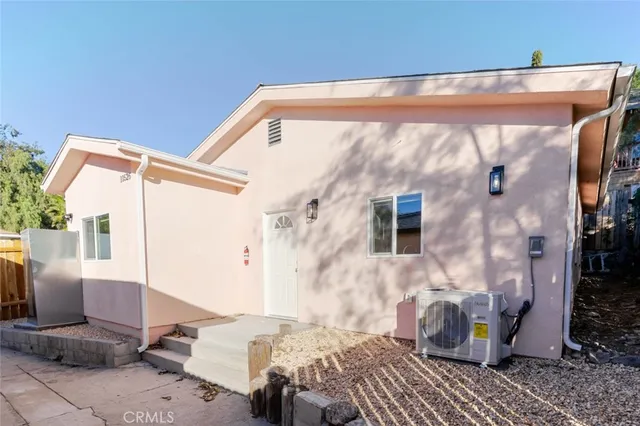 a backyard of a house with outdoor seating