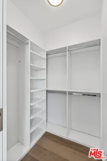 a view of an empty walk in closet
