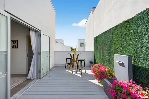 a view of dining room with furniture and wooden floor