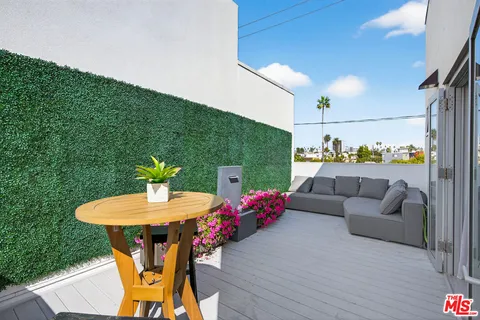 a outdoor living space with furniture and garden view