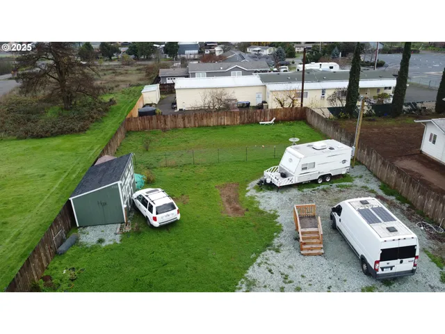 a picture of a table and chairs with the garden