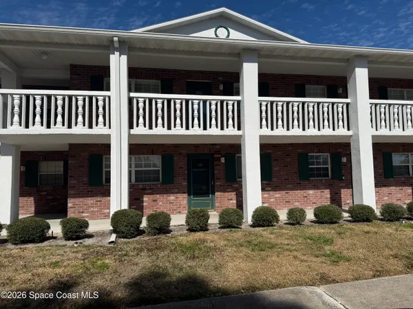 a view of a house with entrance gate