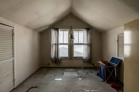 an empty room with windows