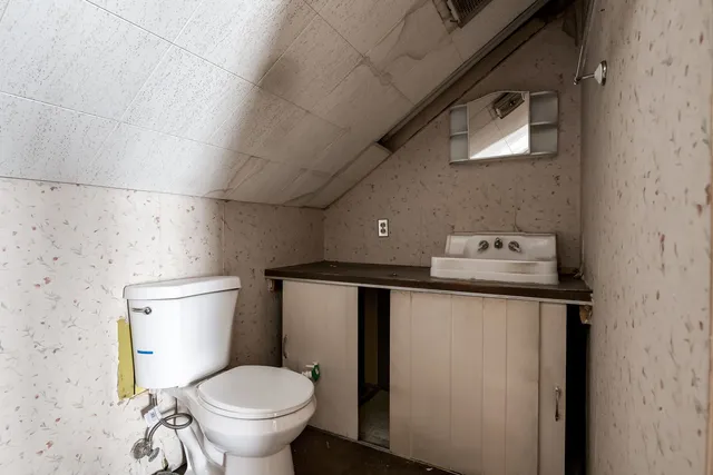 a bathroom with a toilet and a sink