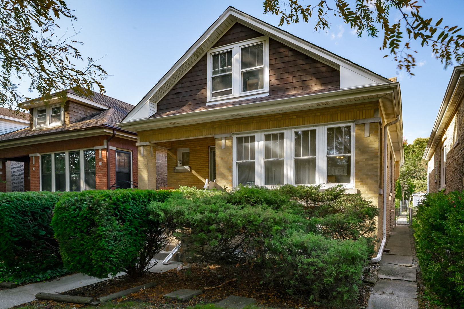 4648 North Lawler Avenue Chicago, IL 60630 - Photo 2 of 23 a view of a house with large windows and a yard