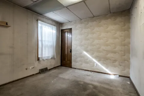 an empty room with windows