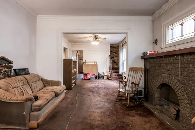 a living room with furniture and a fireplace
