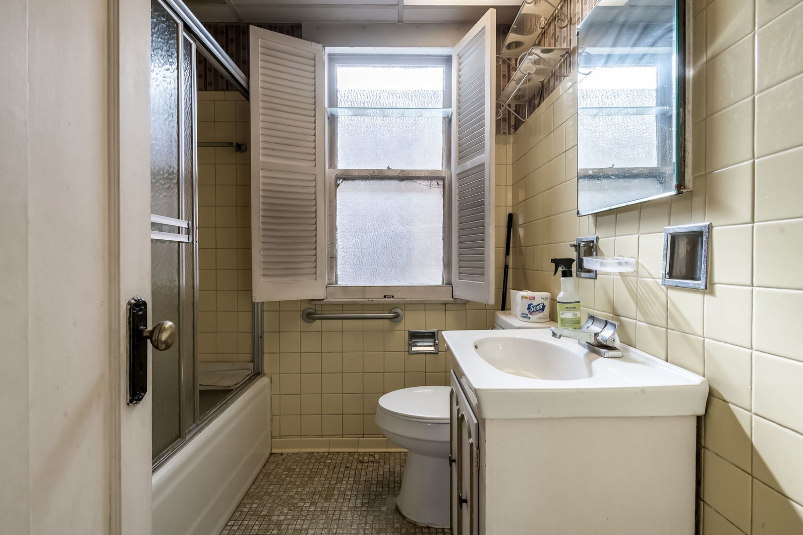 4648 North Lawler Avenue Chicago, IL 60630 - Photo 8 of 23 a bathroom with a sink a toilet and shower