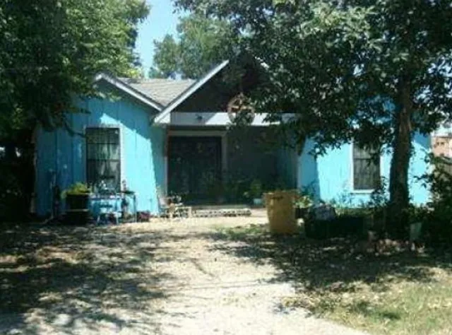a backyard of a house with yard and outdoor seating
