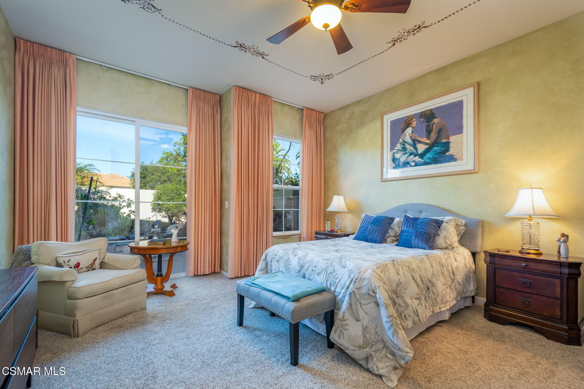 1126 Corte Riviera Camarillo, CA 93010 - Photo 18 of 36 a bedroom with a bed and a chandelier