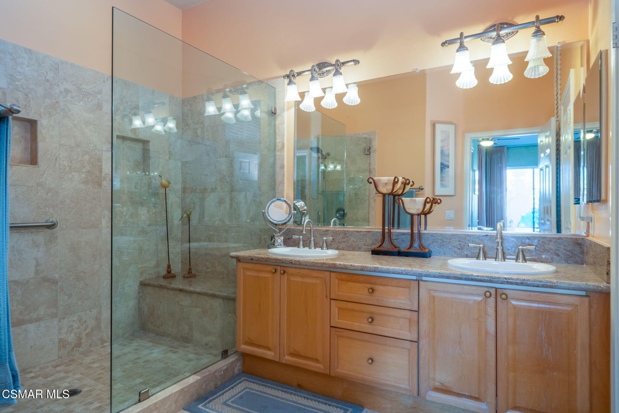 1126 Corte Riviera Camarillo, CA 93010 - Photo 19 of 36 a bathroom with a granite countertop sink a mirror and a shower