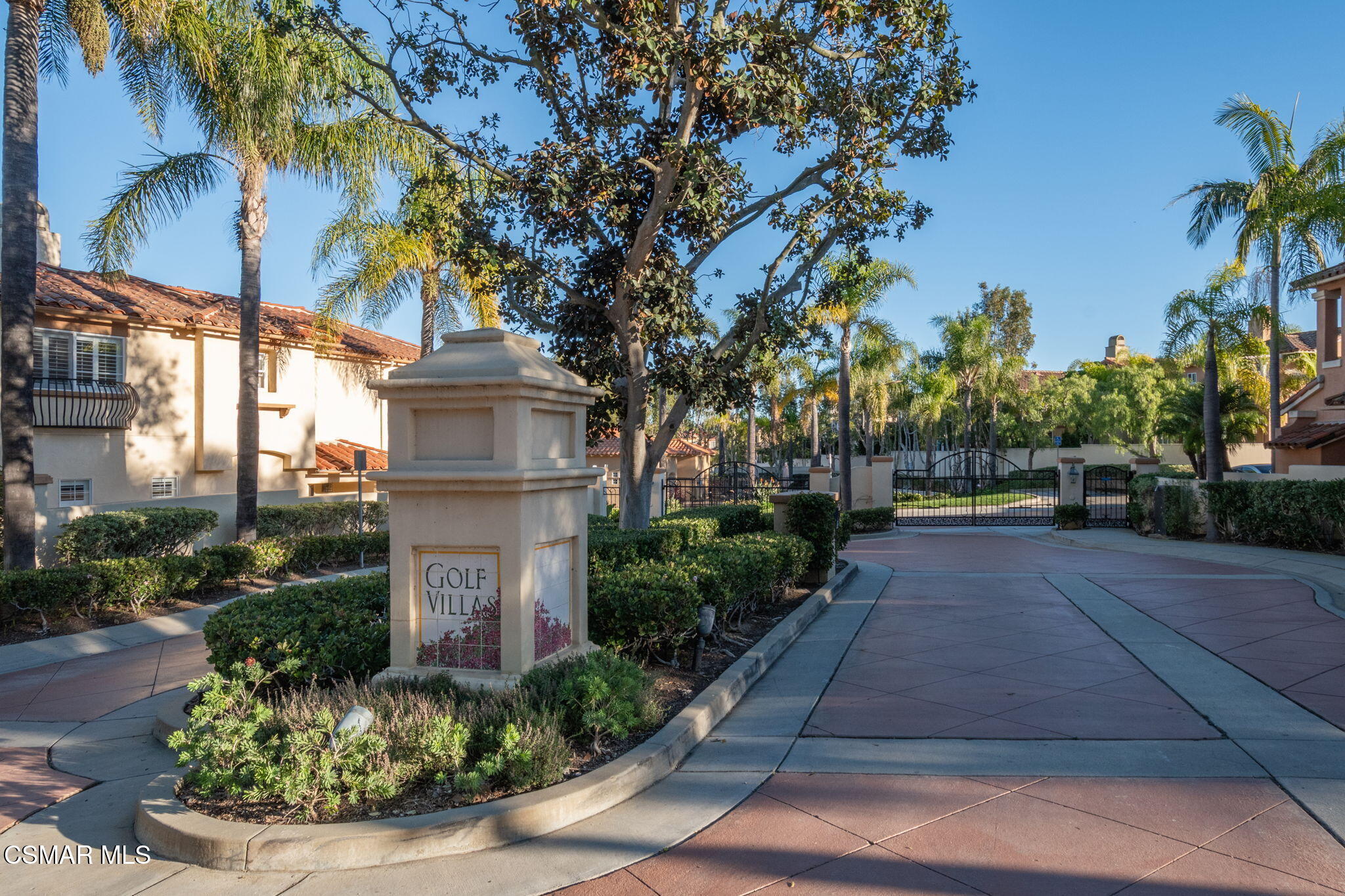 1126 Corte Riviera Camarillo, CA 93010 - Photo 2 of 36 a front view of a house with a yard and potted plants
