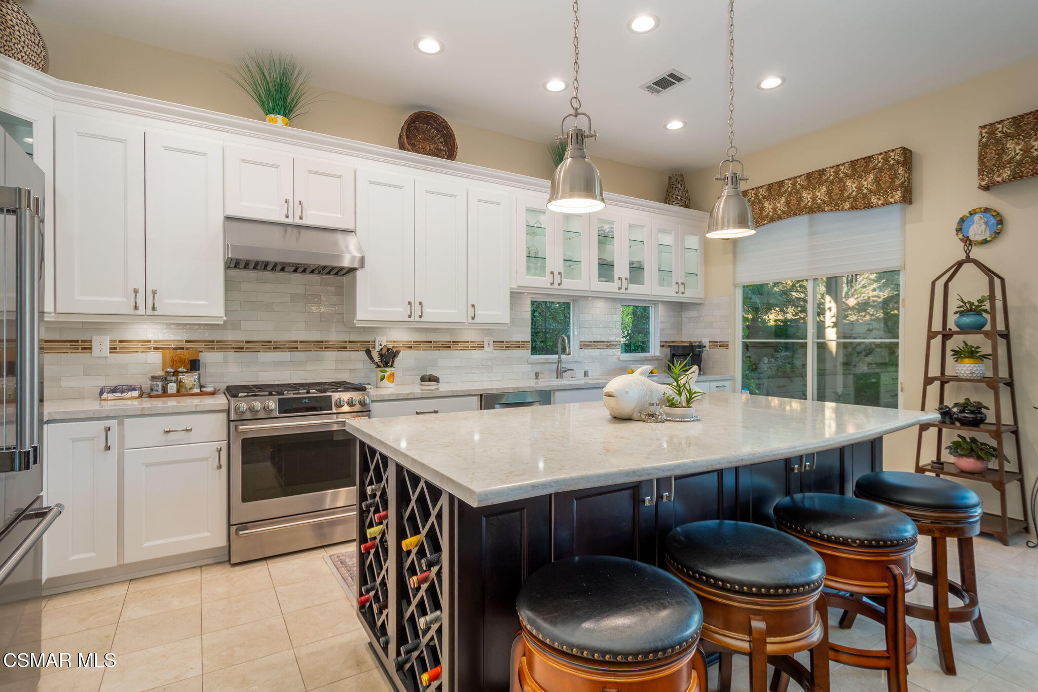 1126 Corte Riviera Camarillo, CA 93010 - Photo 10 of 36 a kitchen with a stove a sink and a refrigerator