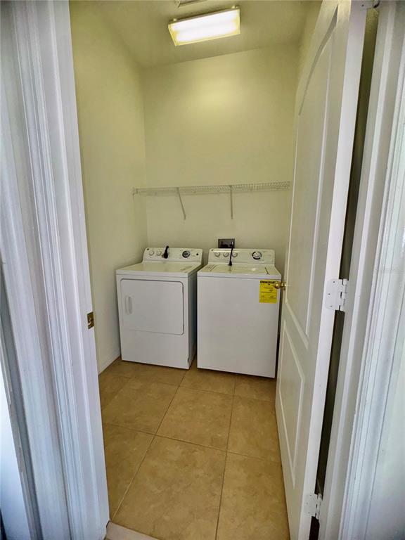 6404 South Goldenrod Road, Unit 2A Orlando, FL 32822 - Photo 22 of 40 a utility room with dryer and washer