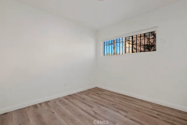 a kitchen with granite countertop white cabinets and a sink