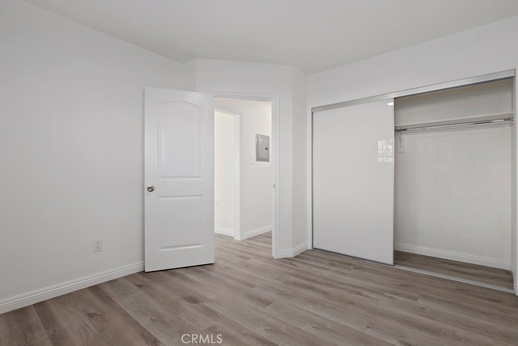 2122 East 10th Street Long Beach, CA 90804 - Photo 29 of 75 a view of an empty room with wooden floor