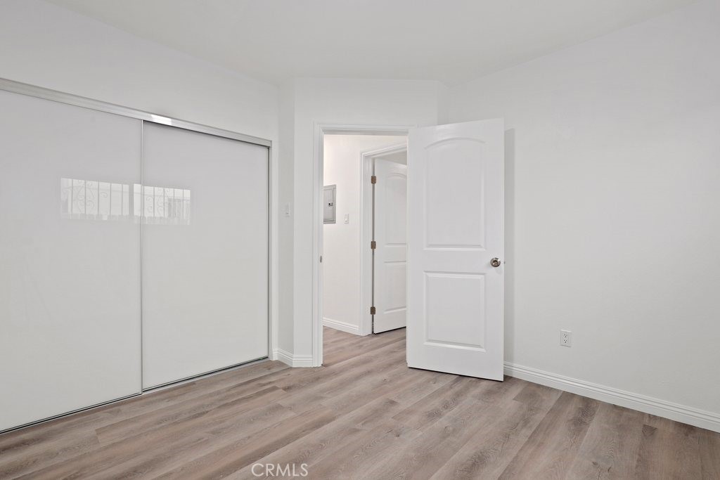 2122 East 10th Street Long Beach, CA 90804 - Photo 35 of 75 a view of an empty room with wooden floor