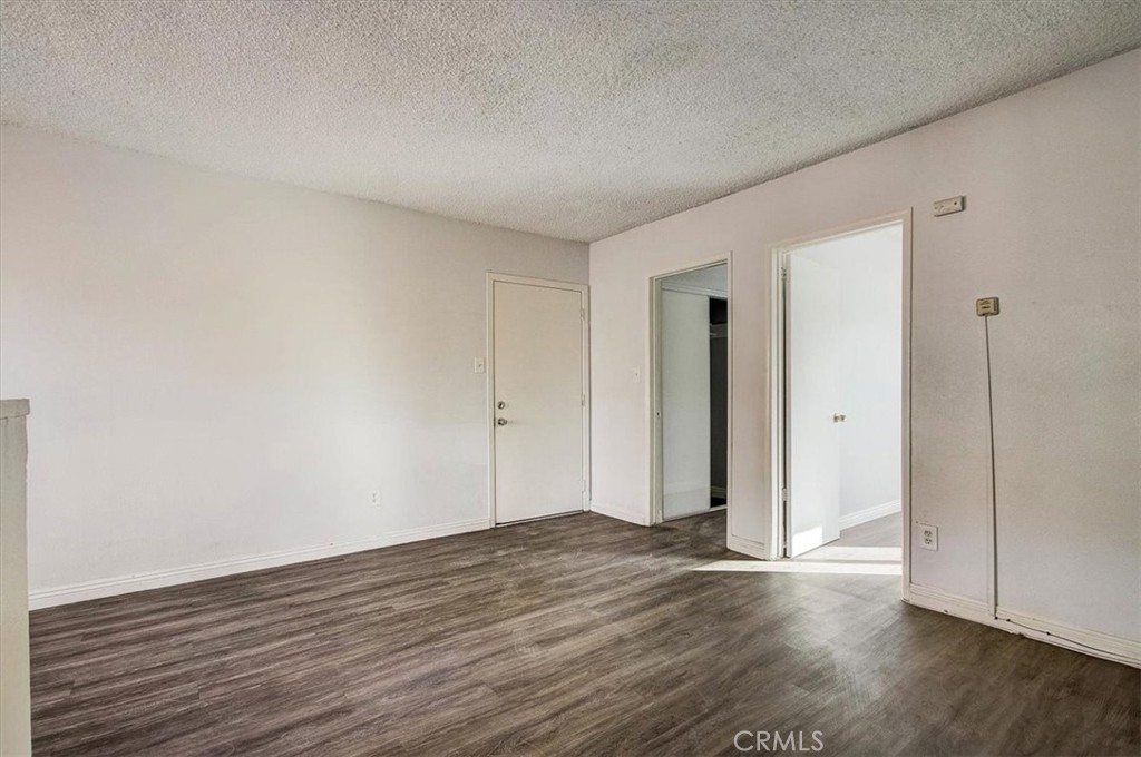 2122 East 10th Street Long Beach, CA 90804 - Photo 45 of 75 a view of an empty room with wooden floor and closet