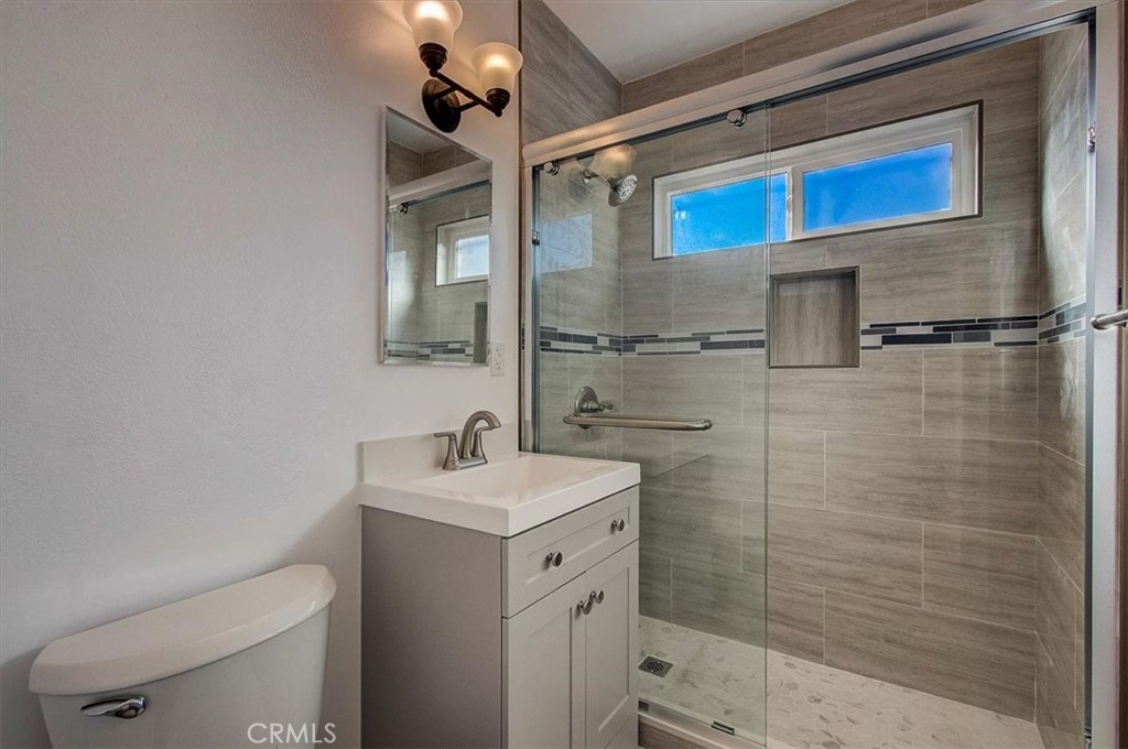 2122 East 10th Street Long Beach, CA 90804 - Photo 57 of 75 a bathroom with a sink a toilet and shower
