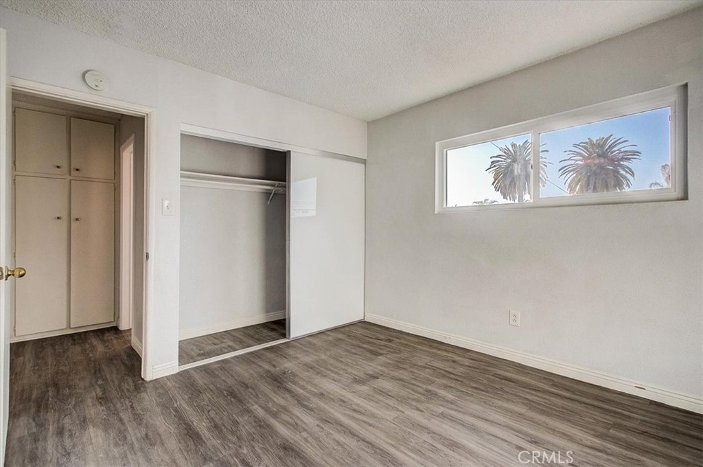 2122 East 10th Street Long Beach, CA 90804 - Photo 59 of 75 a view of an empty room with wooden floor and a window