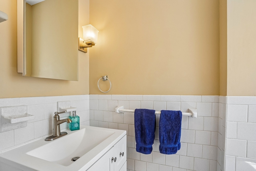 35 Westgate Road Framingham, MA 01701 - Photo 14 of 37 a bathroom with a sink and a mirror