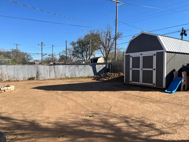 a view of a house with a snow in the yard