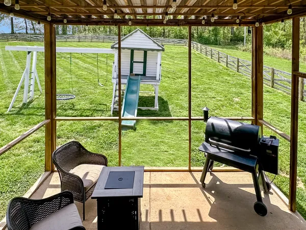 a front view of a house with a yard table and chairs