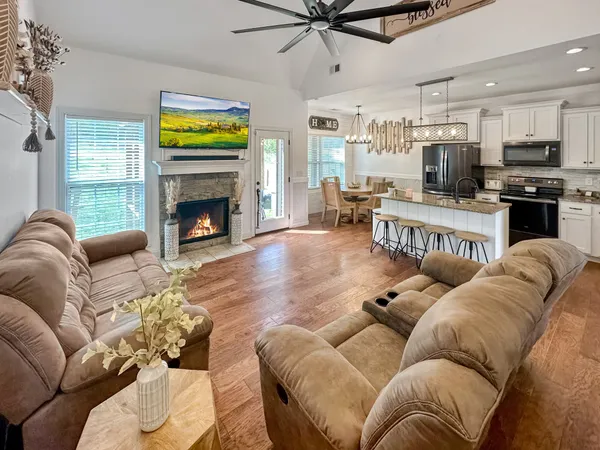 a living room with furniture and a fireplace