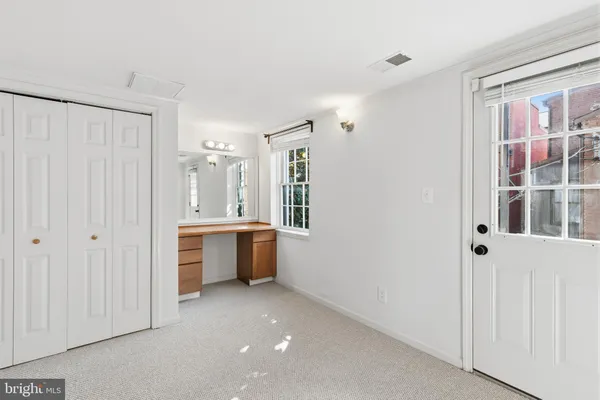 a view of a bathroom with a tub shower and sink
