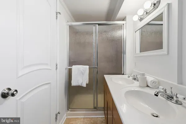 a bathroom with a sink and mirror