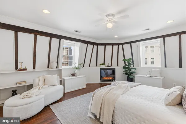 a bedroom with a large bed and a large window